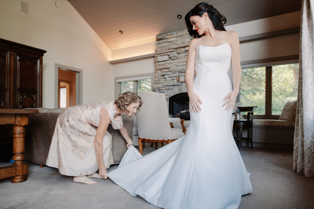 A bride and her mother getting ready for a wedding ceremony in a luxury rental property in Teton Village, WY