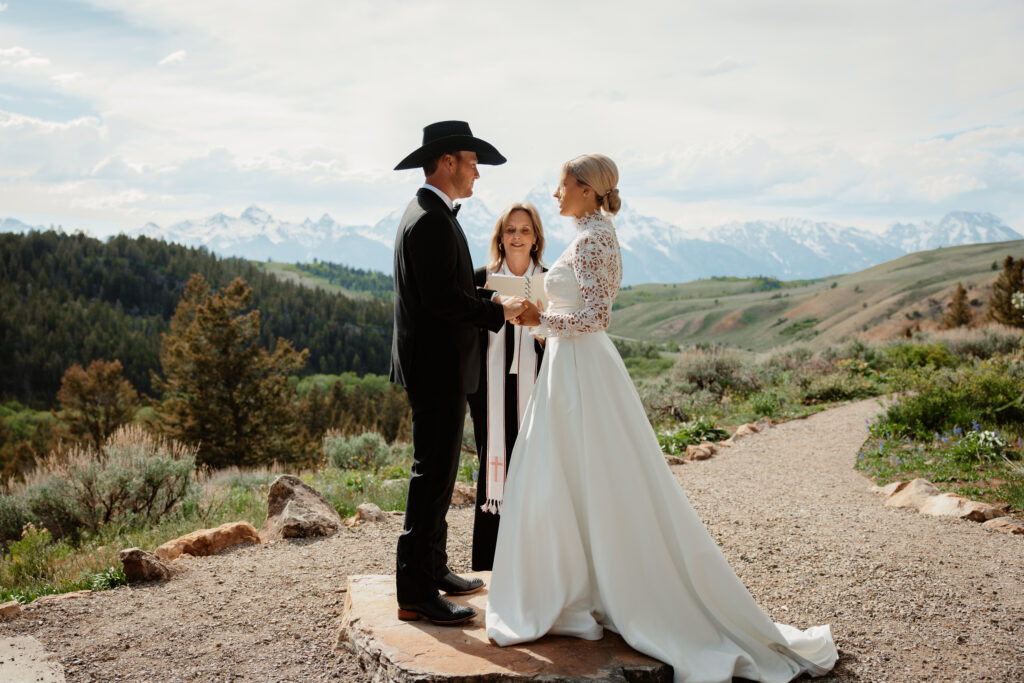 A bride and groom exchange vows during their elopement at the Wedding Tree in Jackson, Wyoming.
